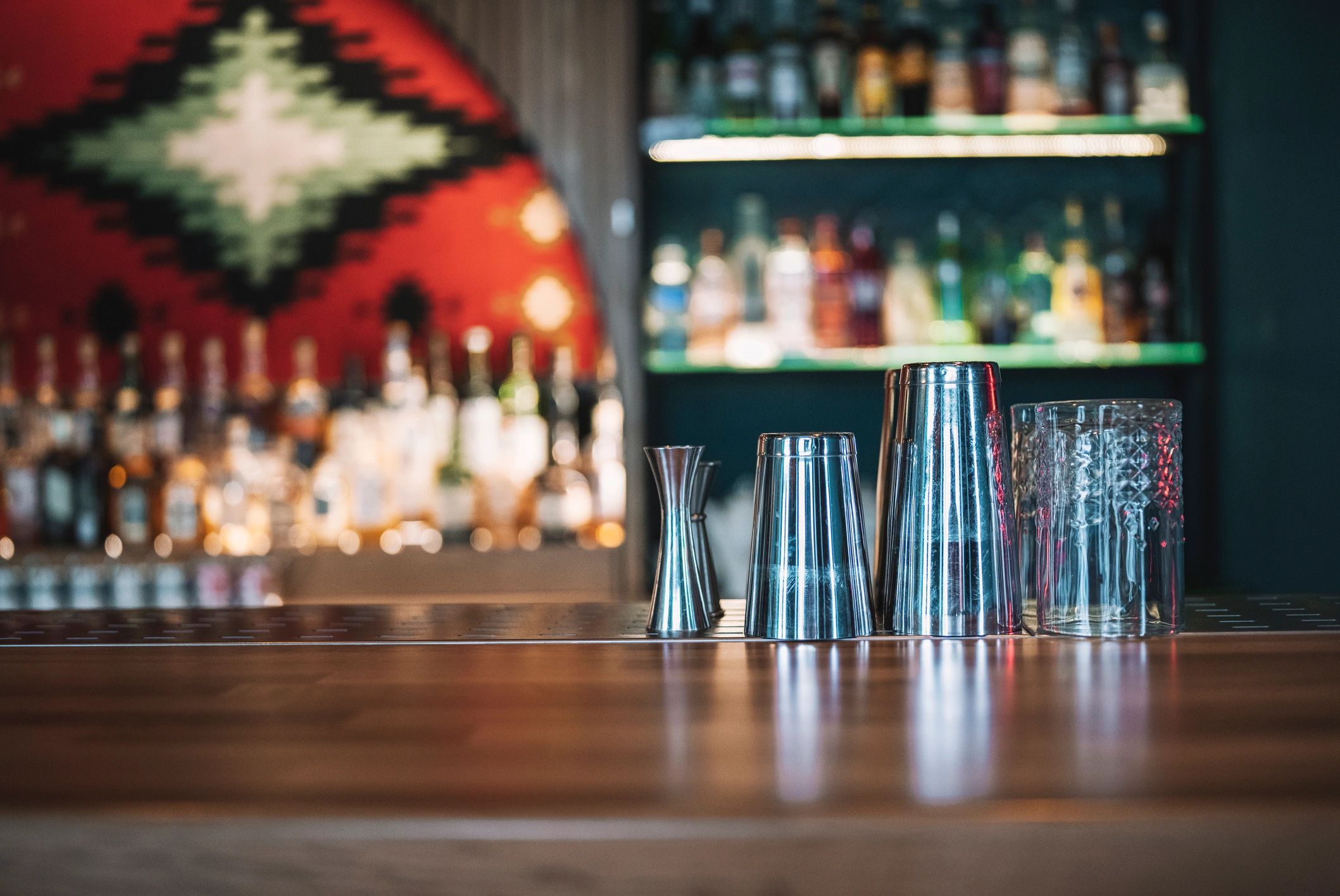 Bar counter accessories suggesting custom engraved drinkware settings