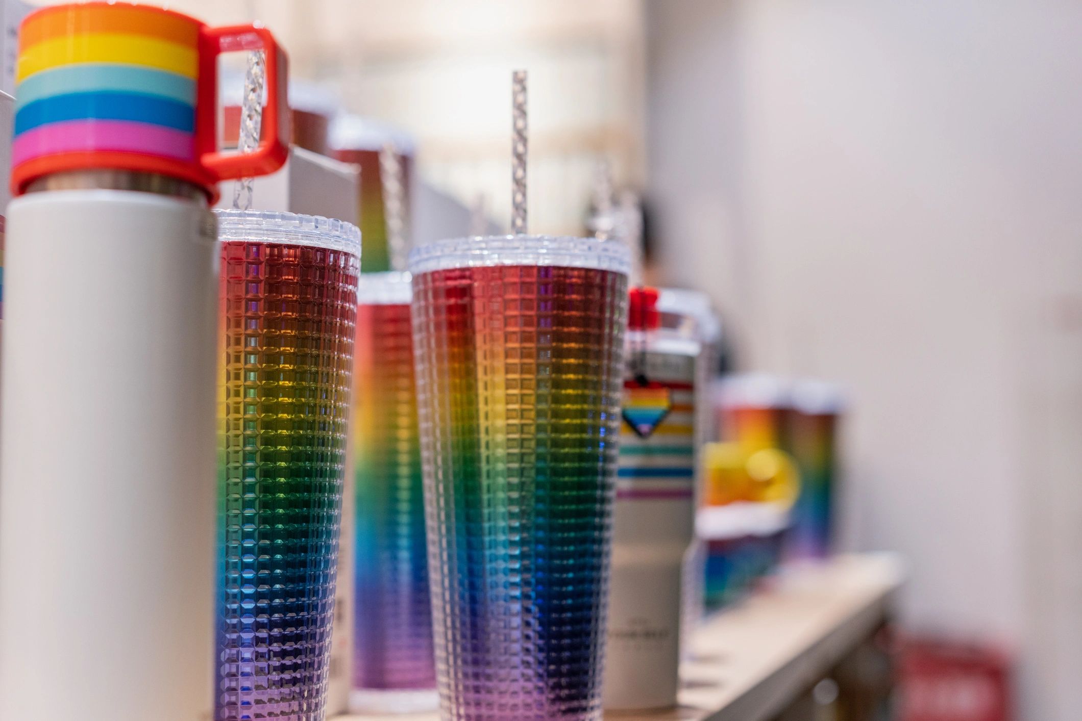 Colorful tumblers displayed together as inspiration for custom engraved drinkware